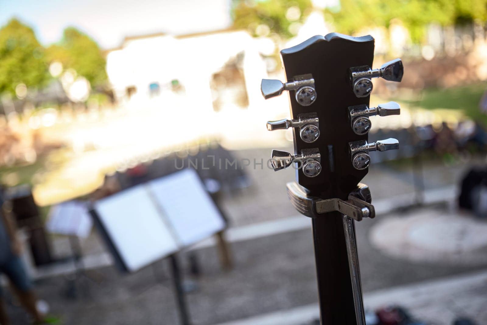 Close-up of a guitar leaned and ready for an electrifying live concert performance.