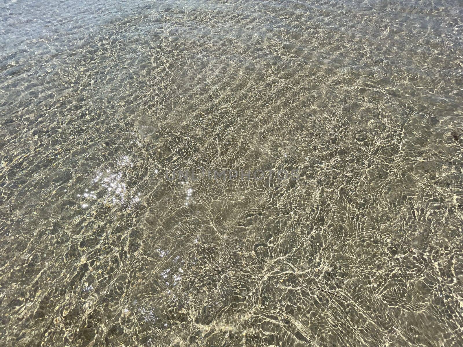 Photo of abstract blue color water wave, pure natural swirl pattern texture, background photography, Blue ocean water texture background. Surface of the sea in bali indonesia