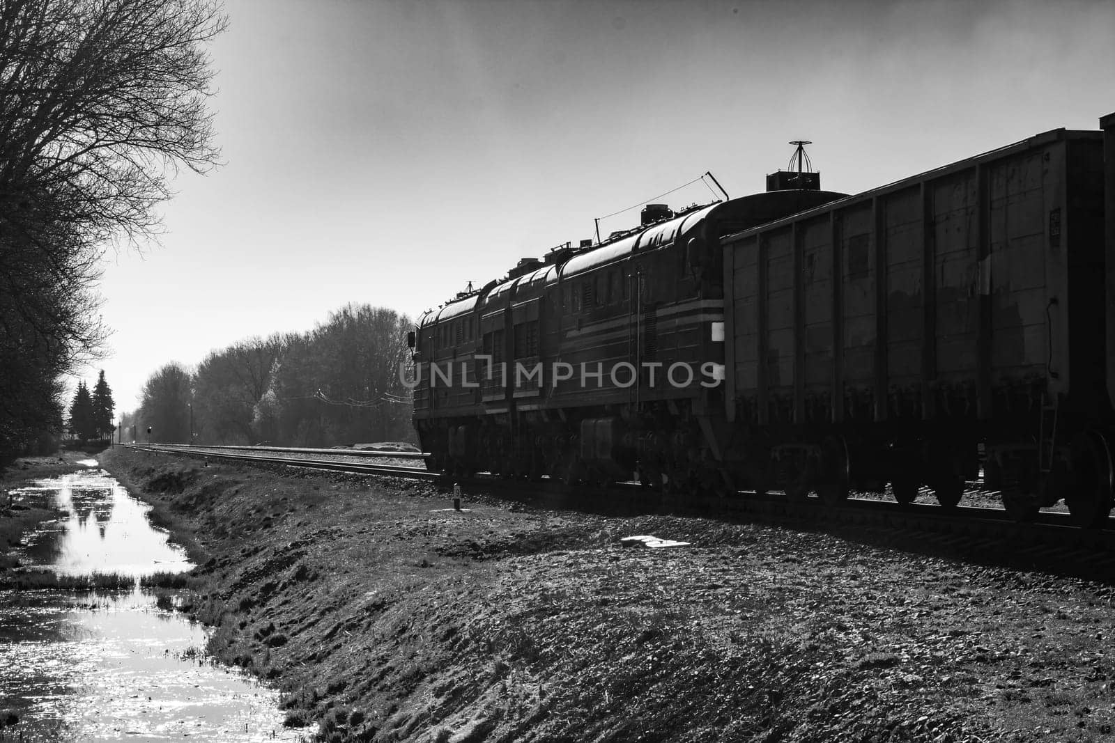 The train car rides on rails, black and white photography