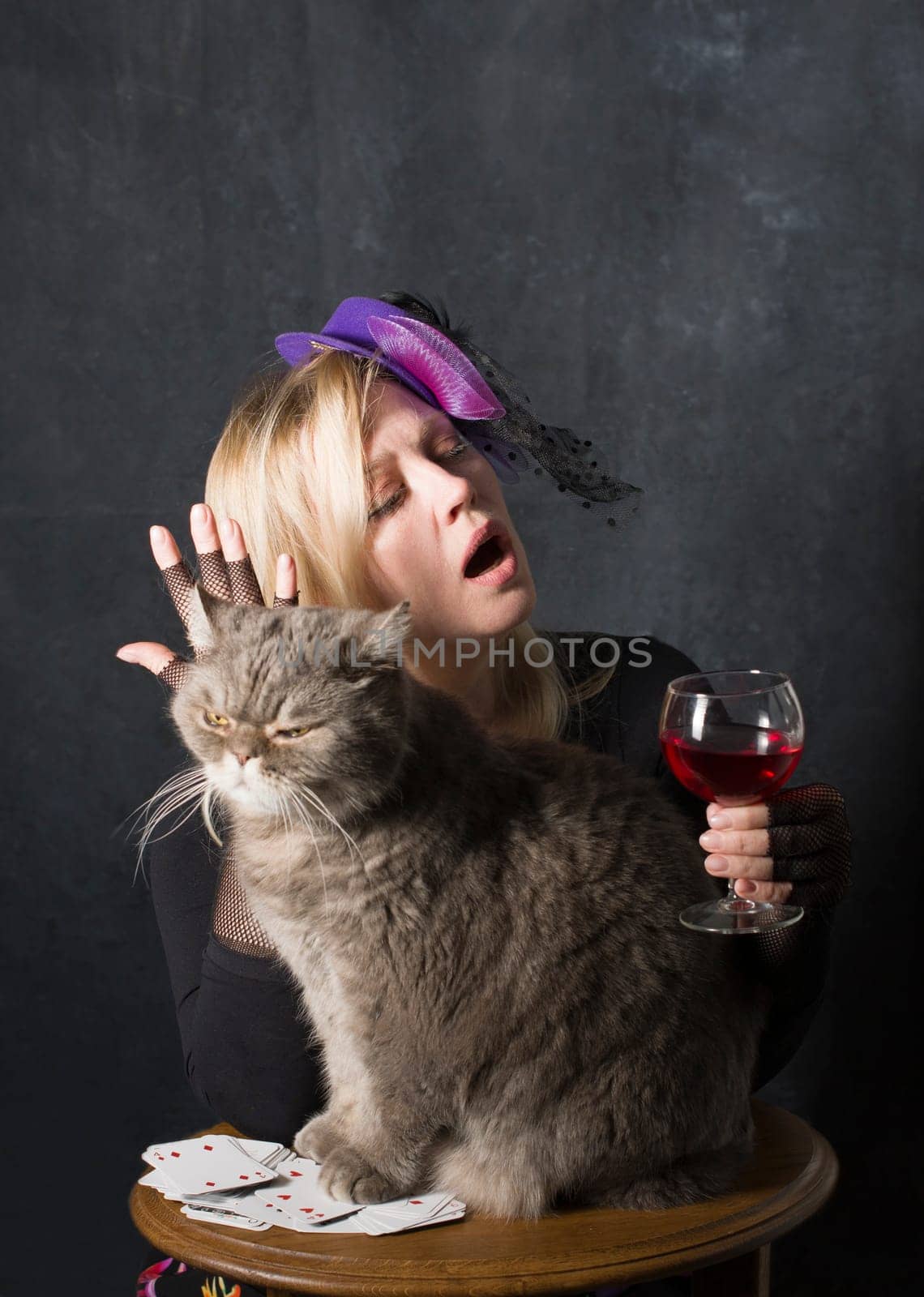 portrait caucasian middel aged woman in black blouse drinking water in the dark room,healthy lifstile concept,best detox drink,elastic skin, strong hair and nails,energy and vigor,High quality photo