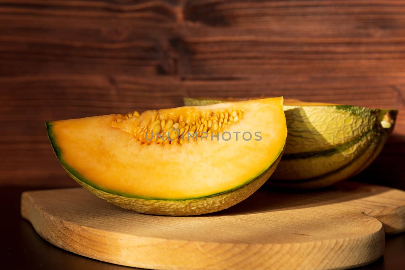 Orange melon harvested in the greenhouse of an organic fruit farm. Favorite fruits in summer.