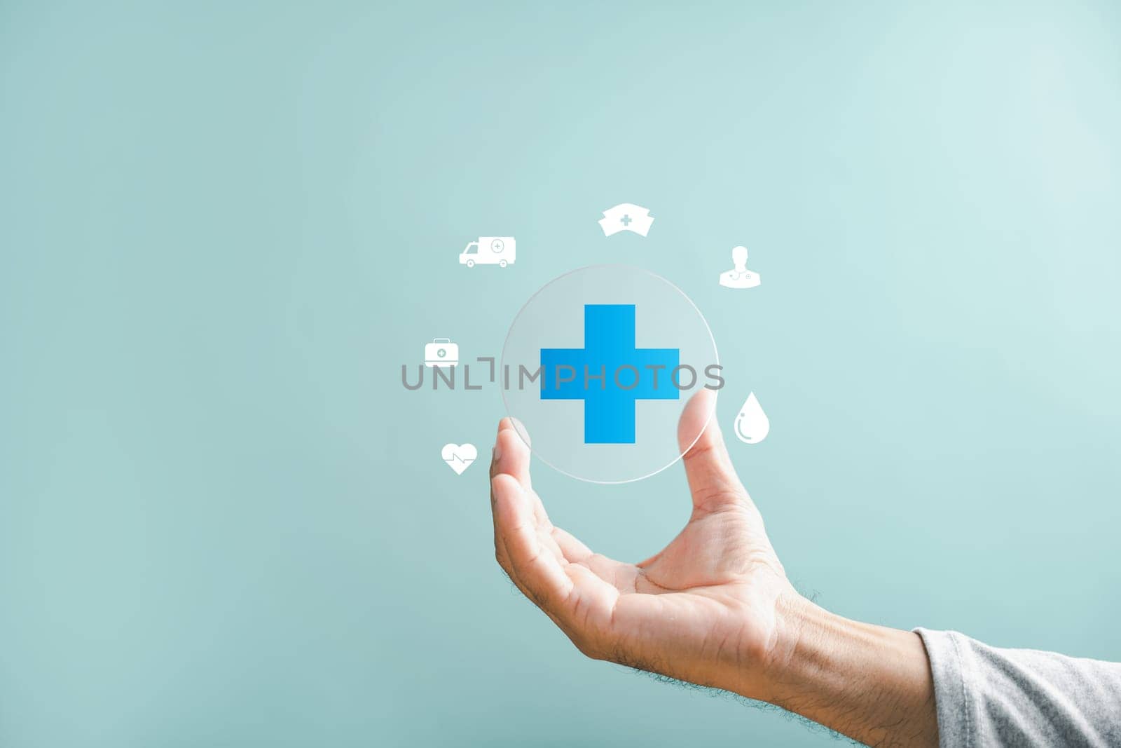 Hand holding plus icon for medical care. Health insurance health concept with access to welfare health and ample copy space. Focuses on value enhancement in healthcare.