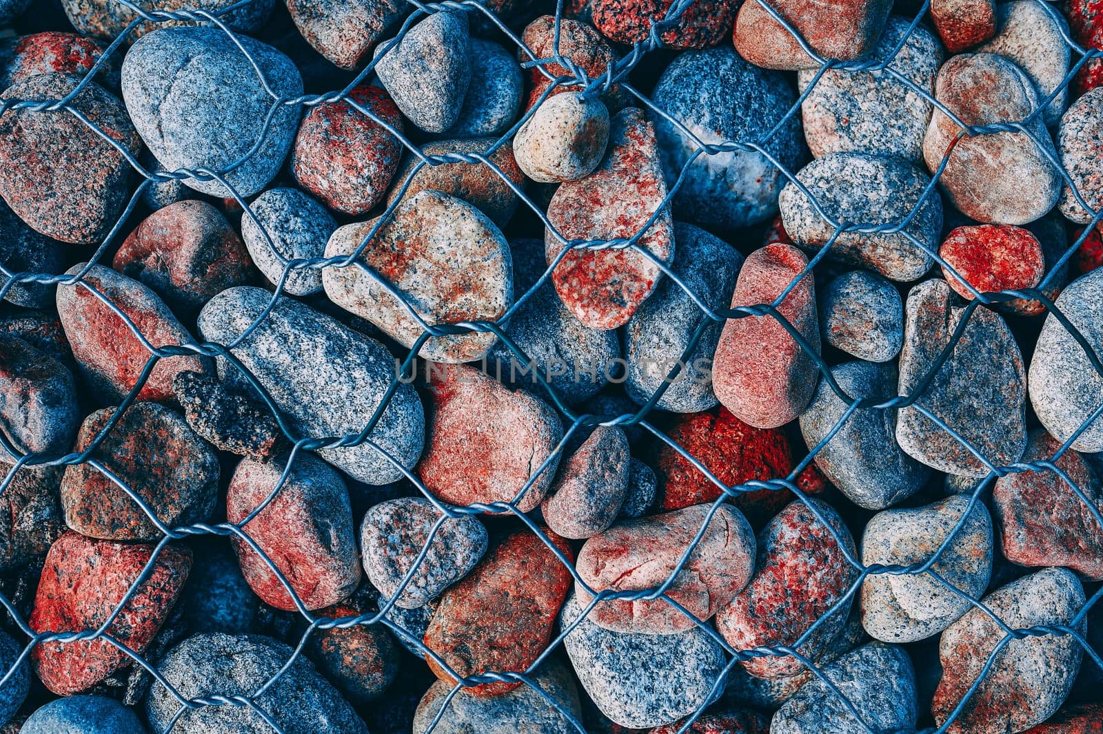 The texture of the rock. Pebble slab and stone for background texture behind bars .