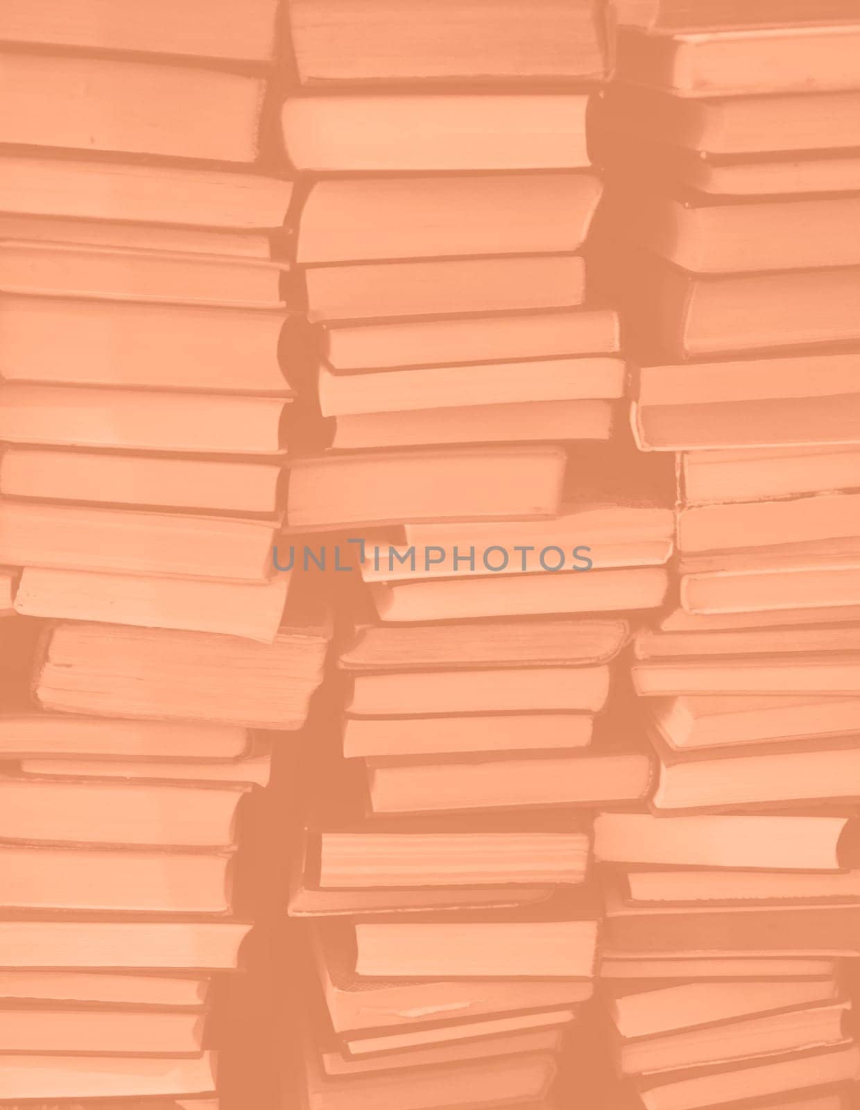 Peach Fuzz colour chaotic stack of old books background. Background from old books that are exhibited in a chaotic manner. Colour of the year 2024. Trendy Peach Fuzz color. by kizuneko