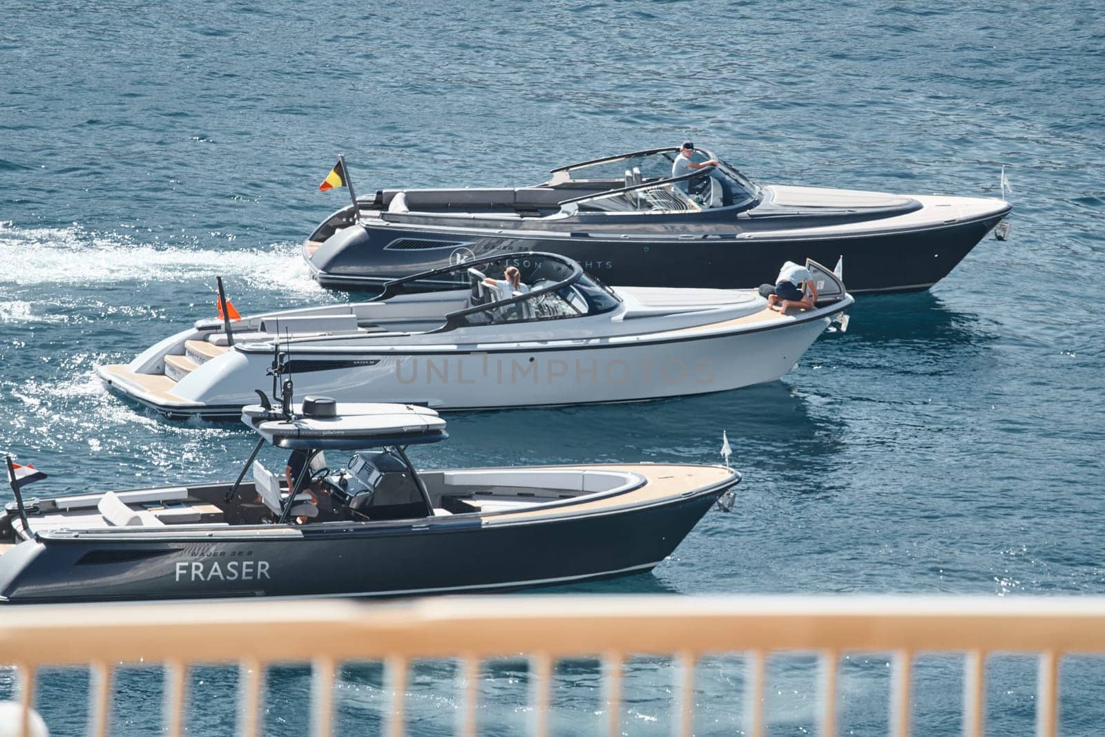 Monaco, Monte Carlo, 27 September 2022 - a boat with guests of yacht brokers departs from the shore in the largest fair exhibition in the world yacht show MYS, port Hercules, rich clients, sunny. High quality photo