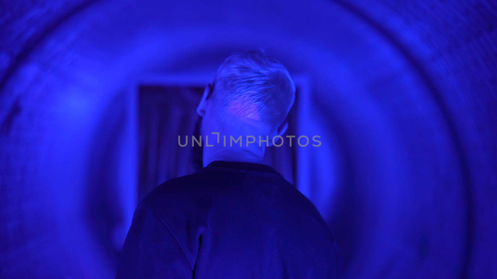Neon light studio close-up portrait of serious man model . High quality photo