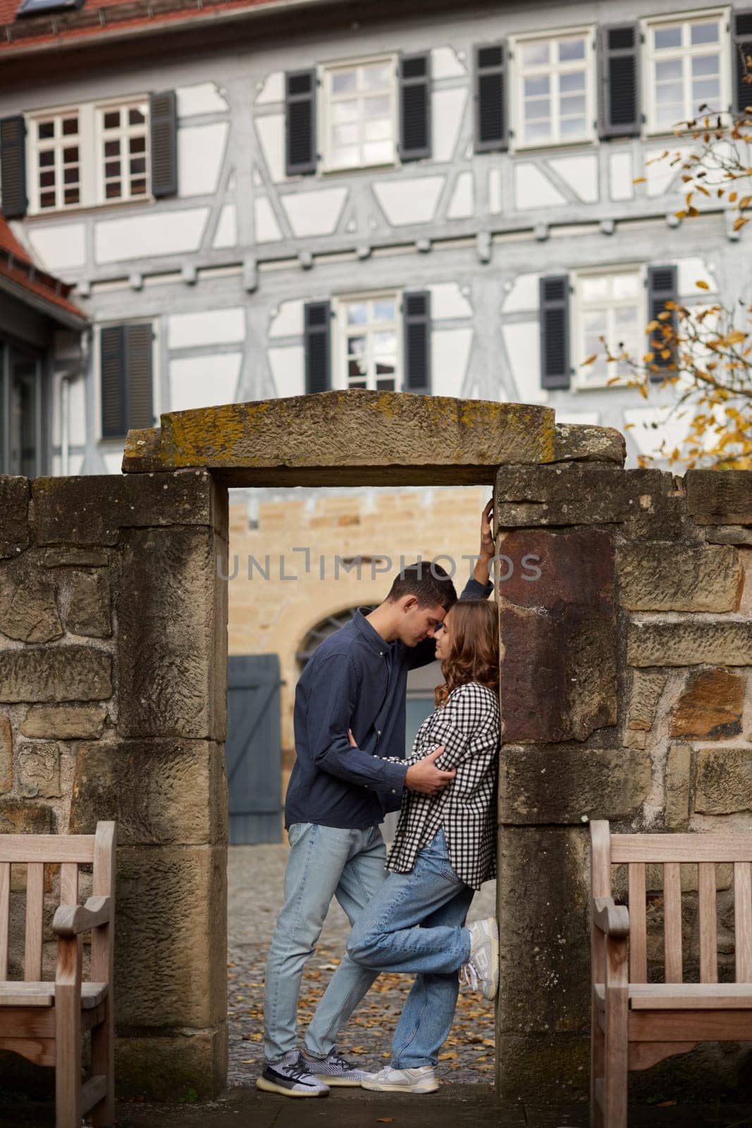 Young Cute Female Hugs Boyfriend. In Autumn Outdoor. Lovers Walking in Park. Attractive Funny Couple. Lovestory in Forest. Man and Woman. Cute Lovers in the Park. Family Concept. Happy Couple.