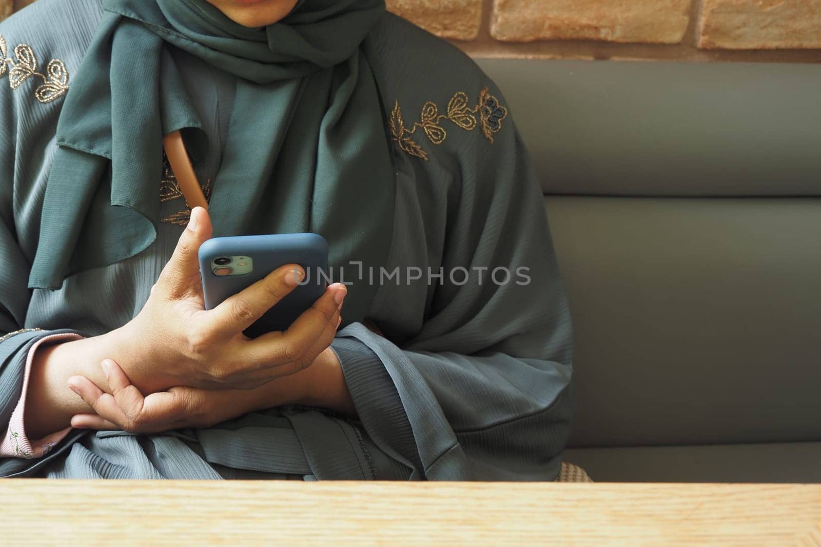 close up of women hand holding smart phone by towfiq007