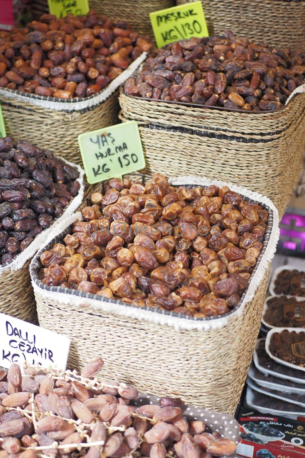 many date fruits display for sale at local market .