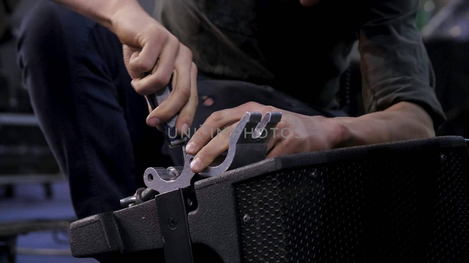Close up of hands screwing together furniture pieces. Man screwing a screw with screwdriver 4K