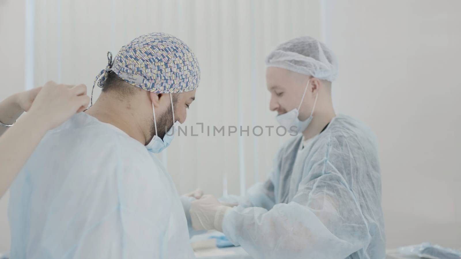 The work of professional doctors. Action. Two men in a suit with equipment are working to help patients. High quality 4k footage