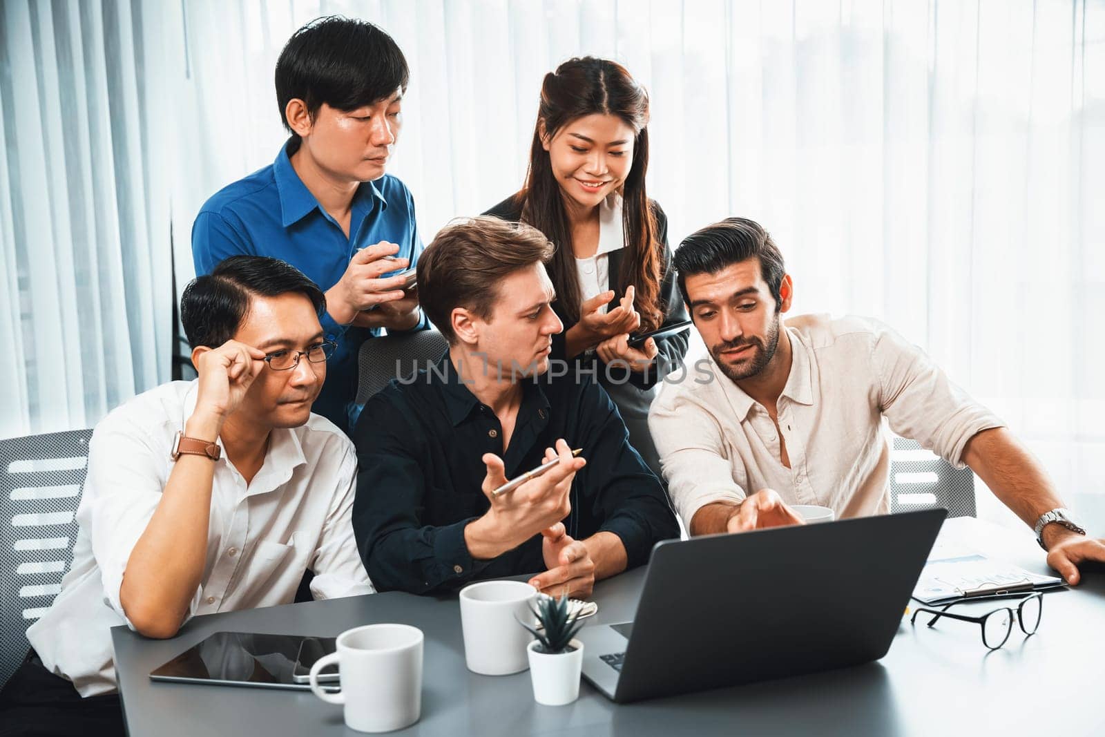 Group of diverse office worker employee working together on strategic business marketing planning in corporate office room. Positive teamwork in business workplace concept. Prudent