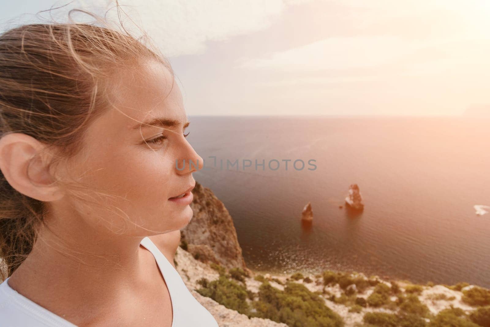 Woman travel sea. Young Happy woman posing on a beach over the sea on background of volcanic rocks, like in Iceland, sharing travel adventure journey by panophotograph