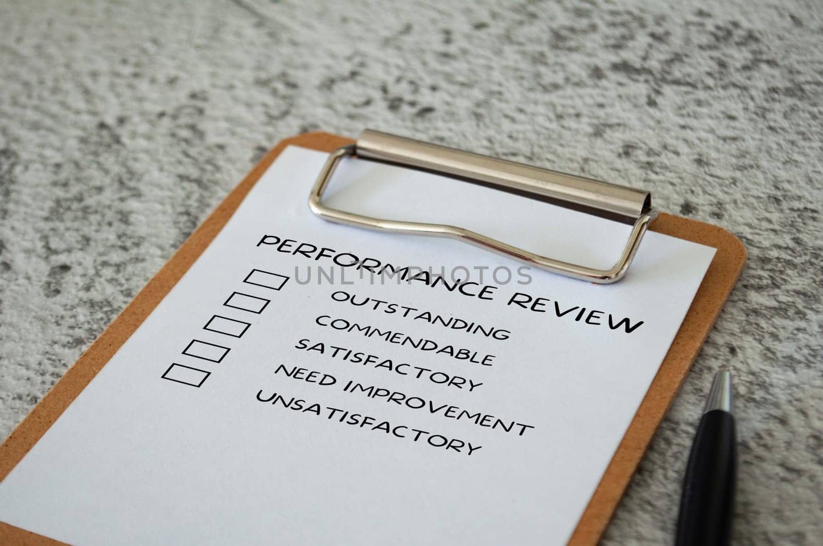 Performance Review checklist on clip board with pen. Performance review concept