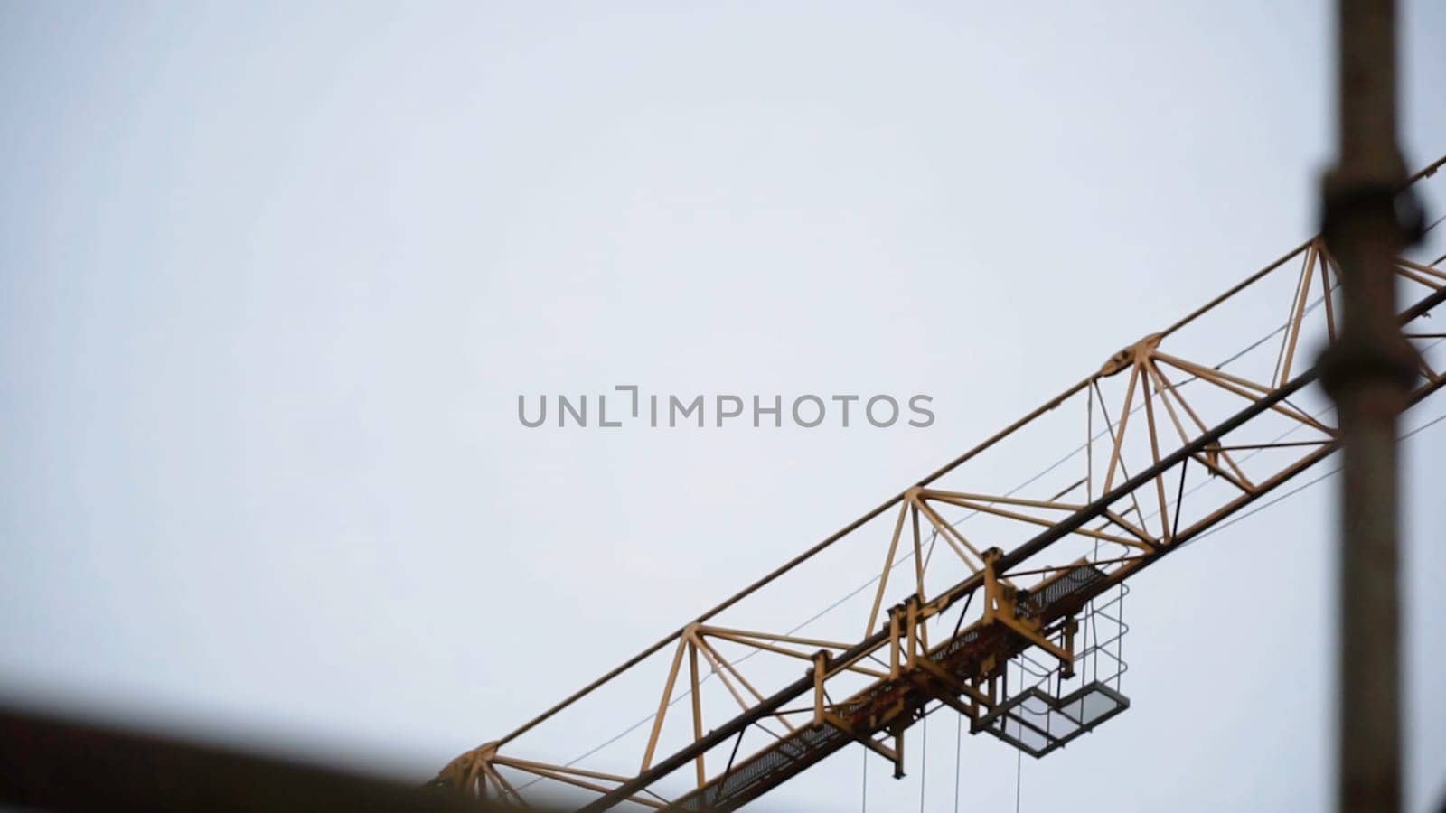 Industrial yellow crane and sky on construction. Clip. Tower yellow crane.