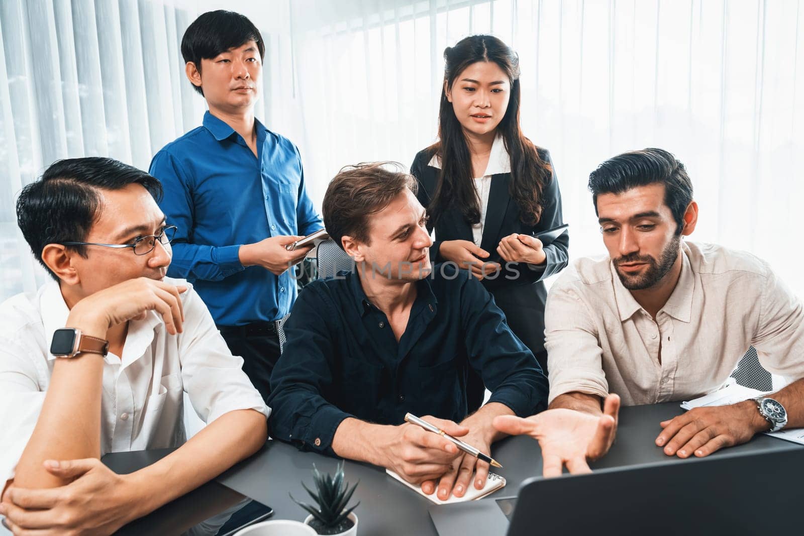 Group of diverse office worker employee working together on strategic business marketing planning in corporate office room. Positive teamwork in business workplace concept. Prudent