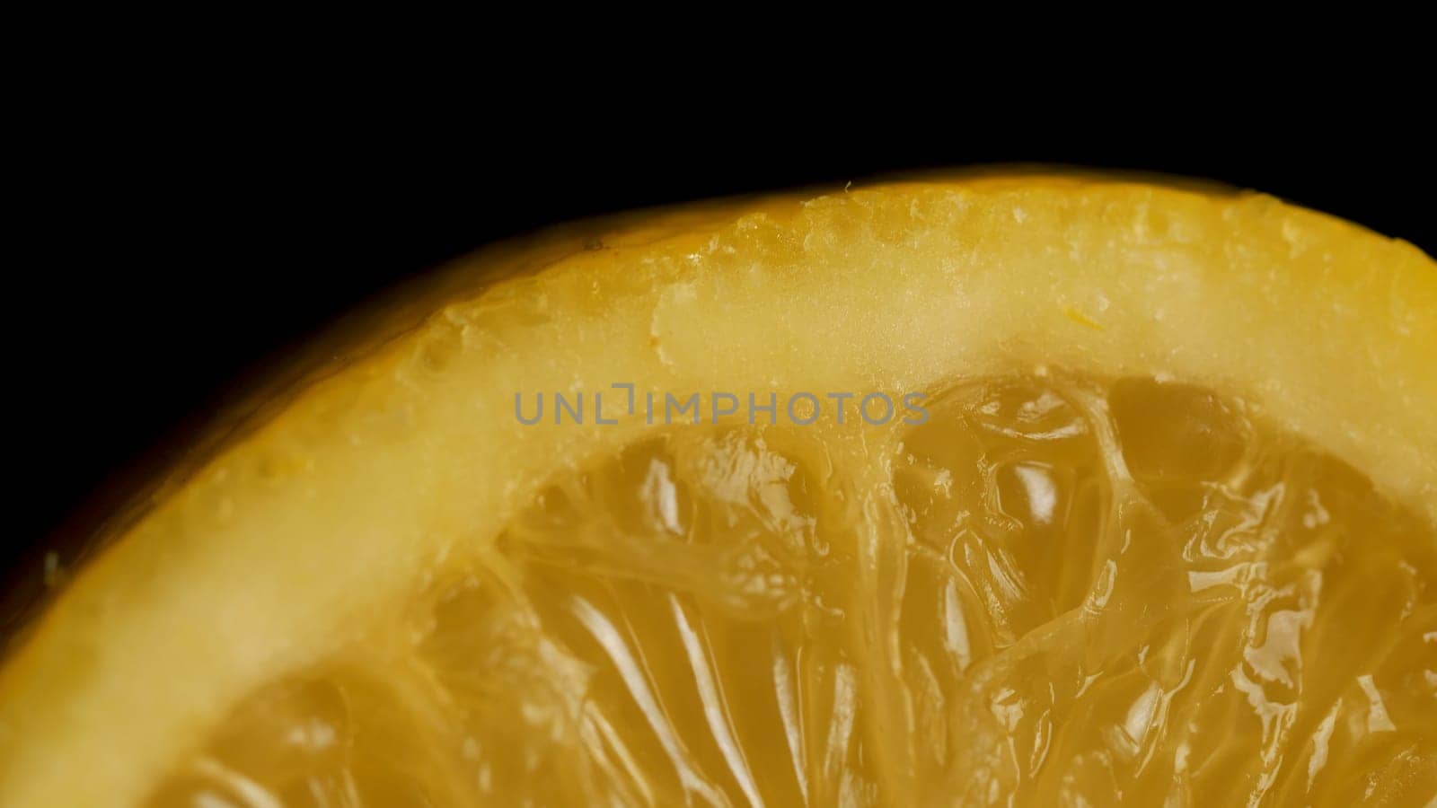 Lemon sectional on black background. Half lemon on a black background. lemon slice on black isolated.