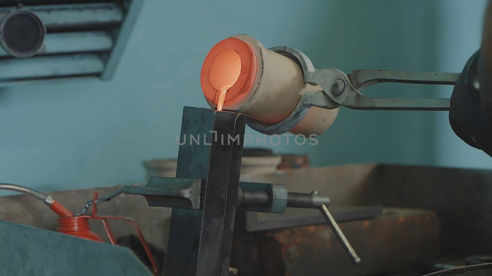 Molten Gold being poured into Ingot moulds. Molten Gold being poured into Ingot moulds. Casting metal or gold being poured into molds in foundry 4K