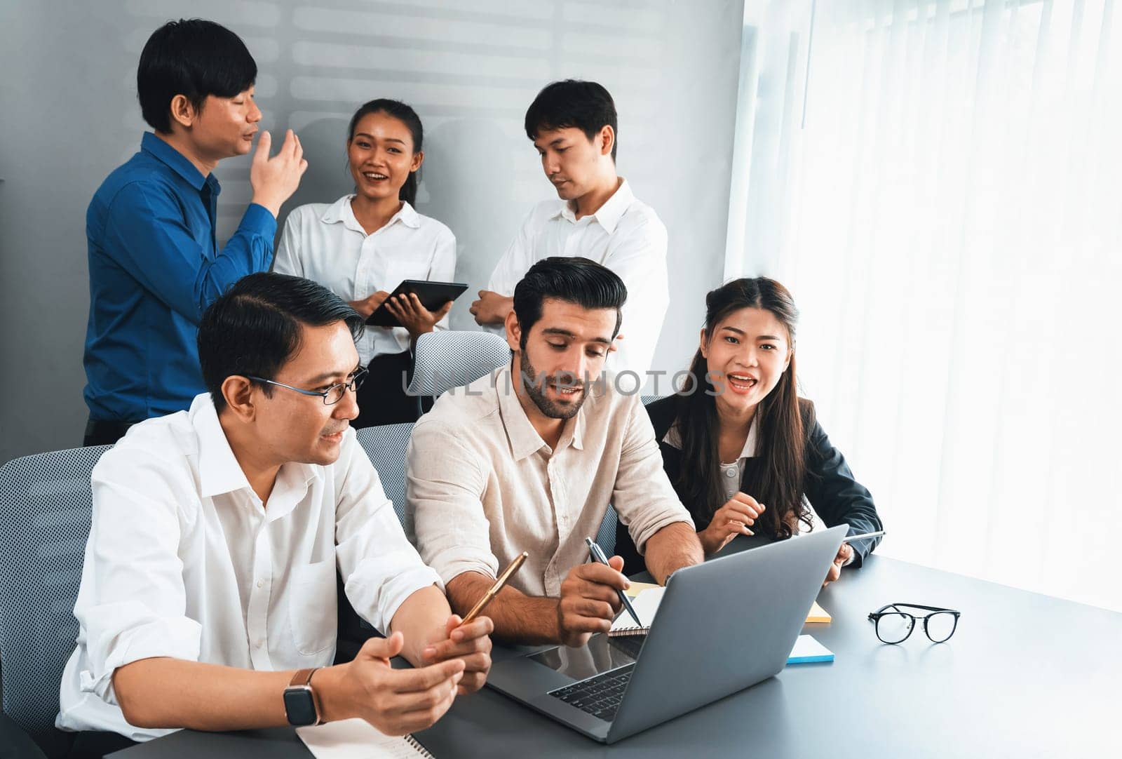 Group of diverse office worker employee working together on strategic business marketing planning in corporate office room. Positive teamwork in business workplace concept. Prudent