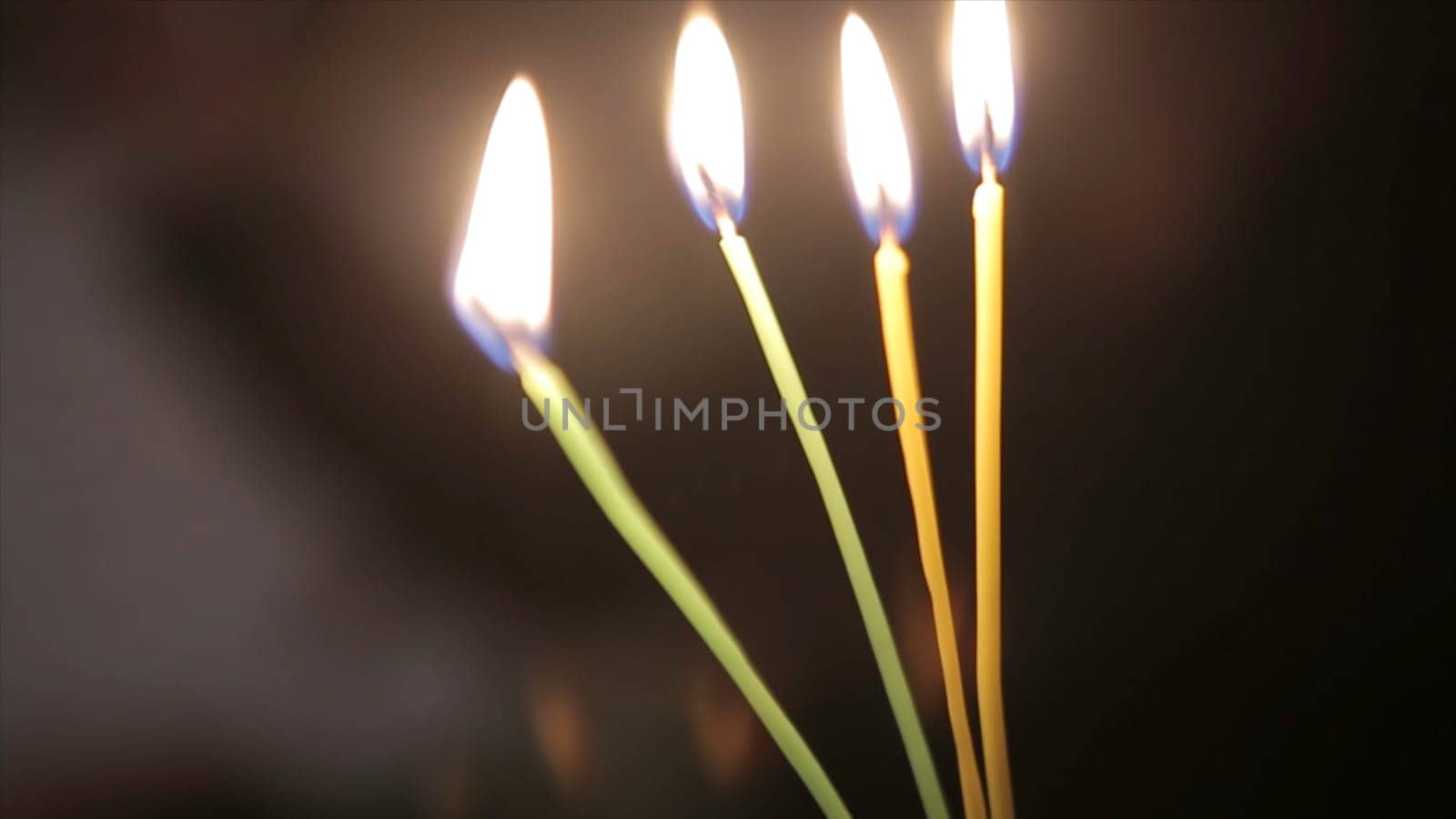 Lighting A Candle With A Match To Get A Romantic Candlelight. Amazing andles and candlesticks are on the table. Stay lights with the peaceful background of religious ceremony HD