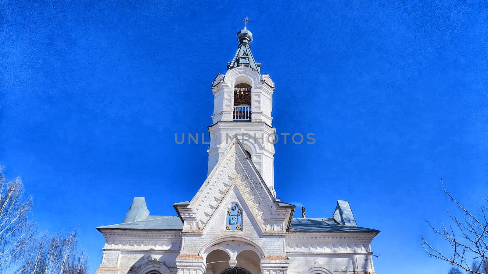 Orthodox church with a dome against the backdrop of a spring or summer sky with clouds. Beautiful old historic temple
