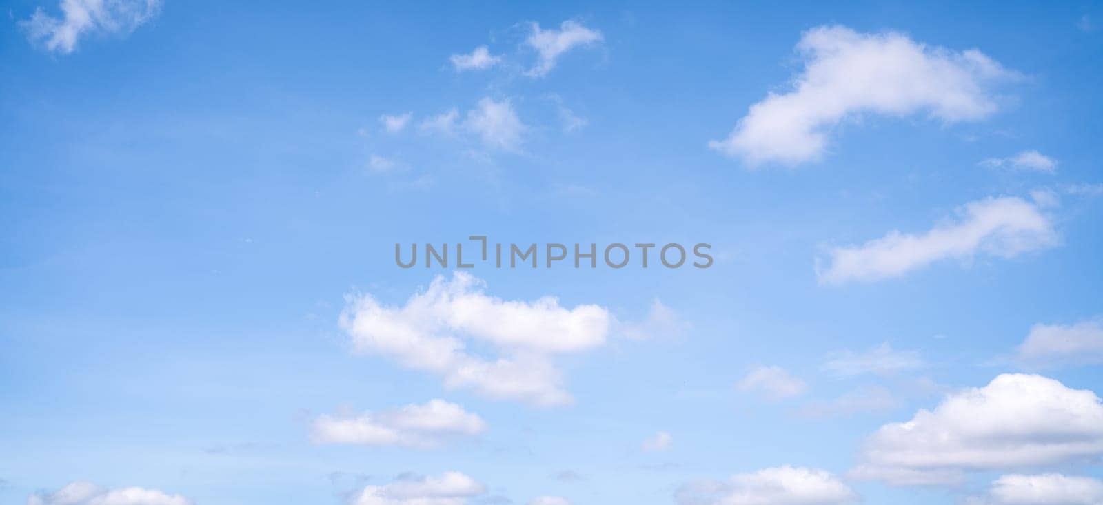 Beautiful blue sky and white cumulus clouds abstract background. Cloudscape background. Blue sky and fluffy white clouds on sunny days. Blue sky and daylight. World Ozone Day. Ozone layer. Summer sky. by Fahroni