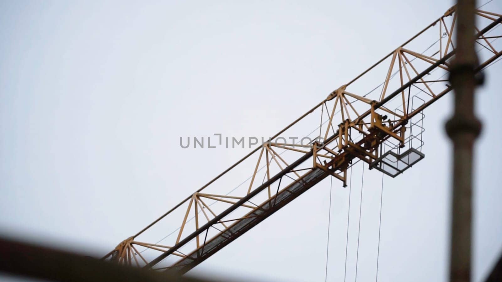 Industrial yellow crane and sky on construction. Clip. Tower yellow crane.