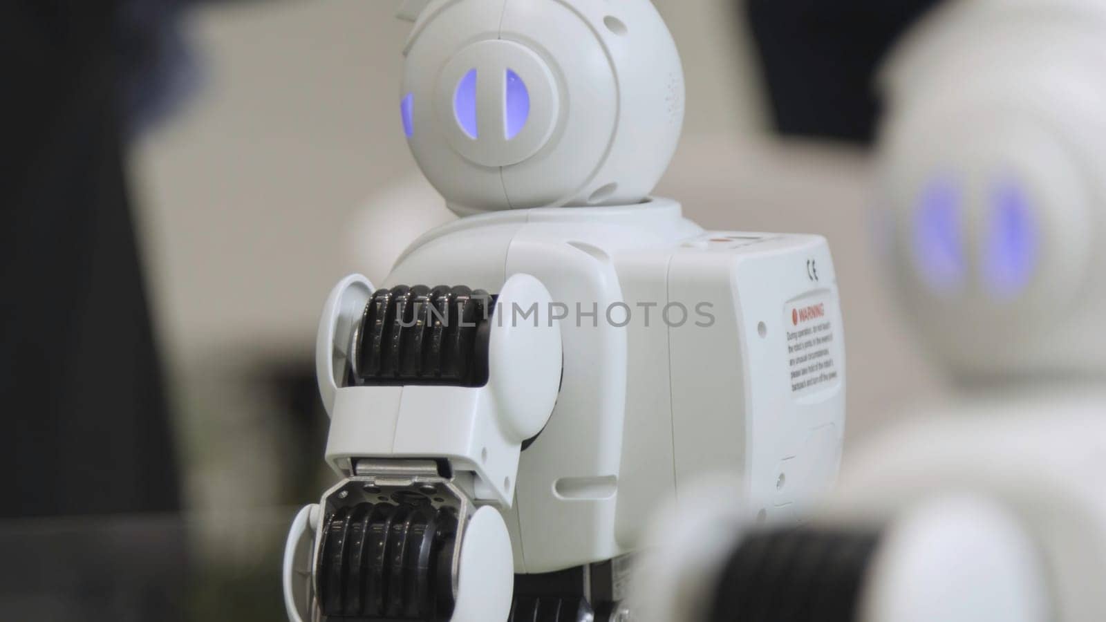 SHANGHAI - JUNE 28 2018: A small robot with human face and body - humanoid. Closeup of an cute autonomous service robot. Close-up of robot head.