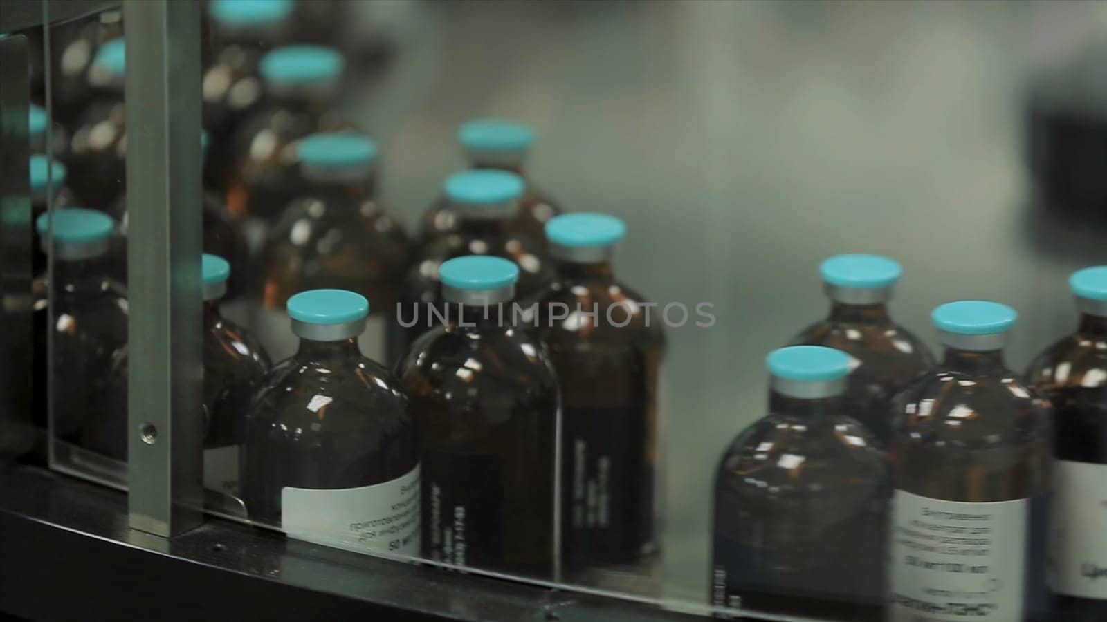 Pharmaceutical industry. Production line machine conveyor at factory with bottles. pharmaceutical production of liquid pharmaceuticals HD
