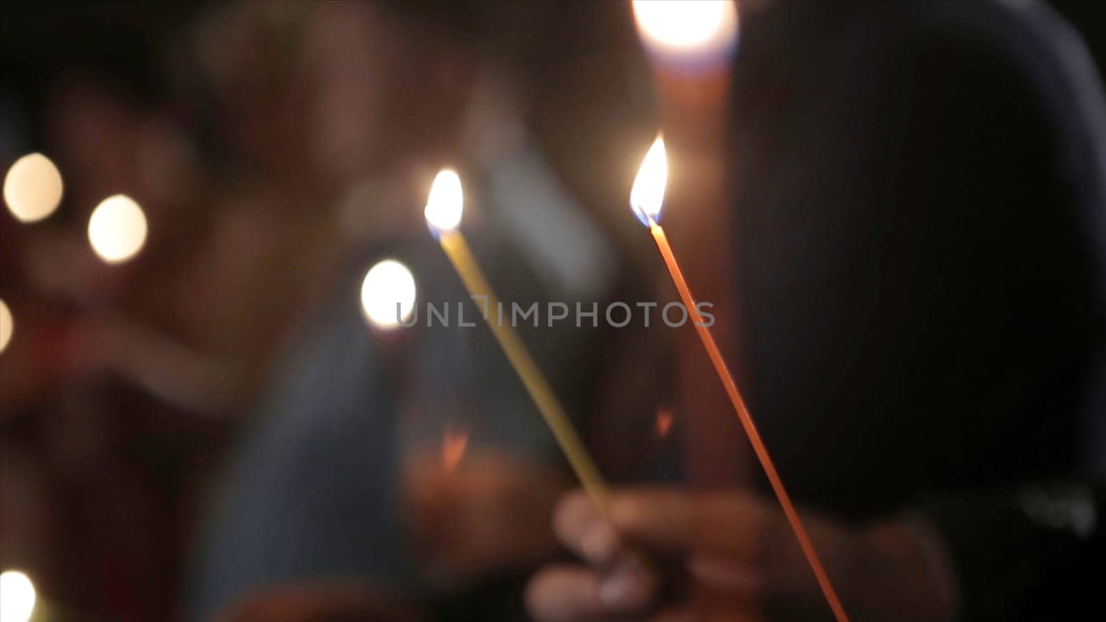 Lighting A Candle With A Match To Get A Romantic Candlelight. Amazing andles and candlesticks are on the table. Stay lights with the peaceful background of religious ceremony HD