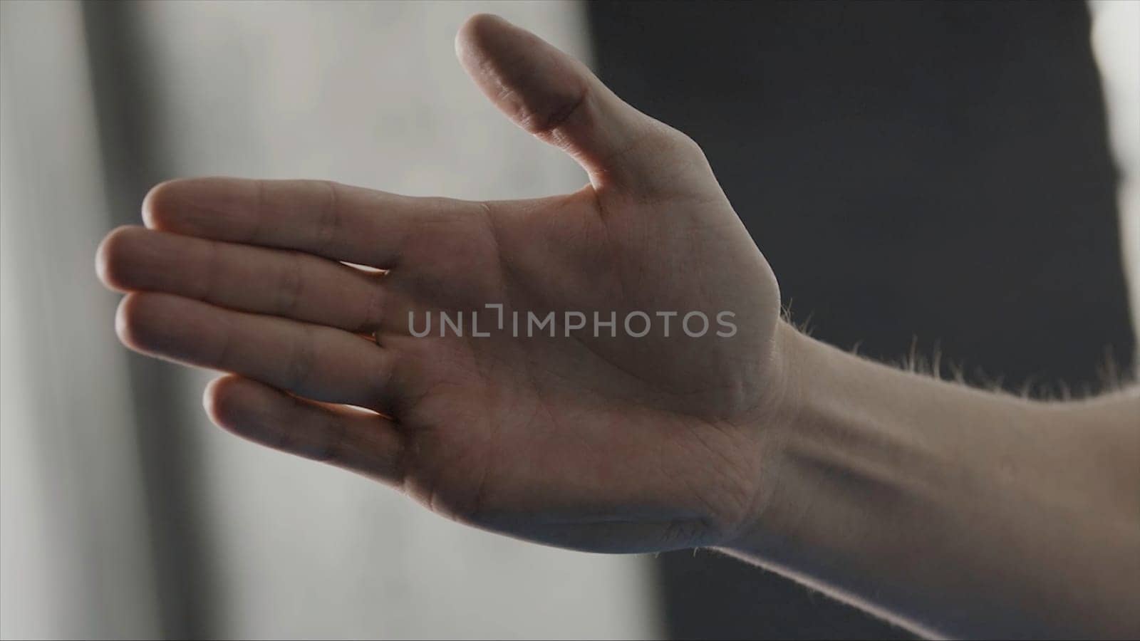 Action of man posture in guard by palm in karate style, close up. Man stood in martial art position.