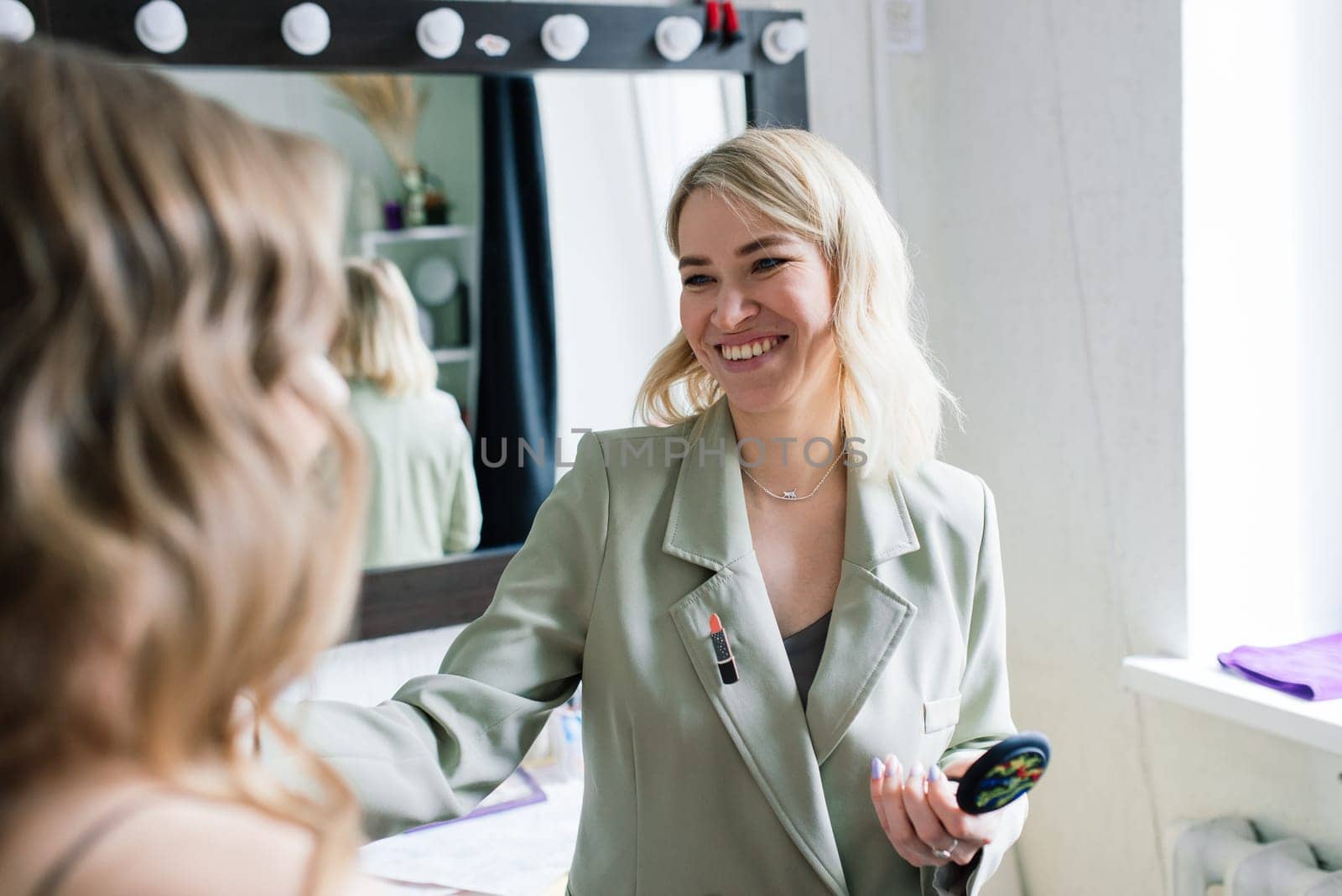 Make-up artist work in her studio with model by Zelenin