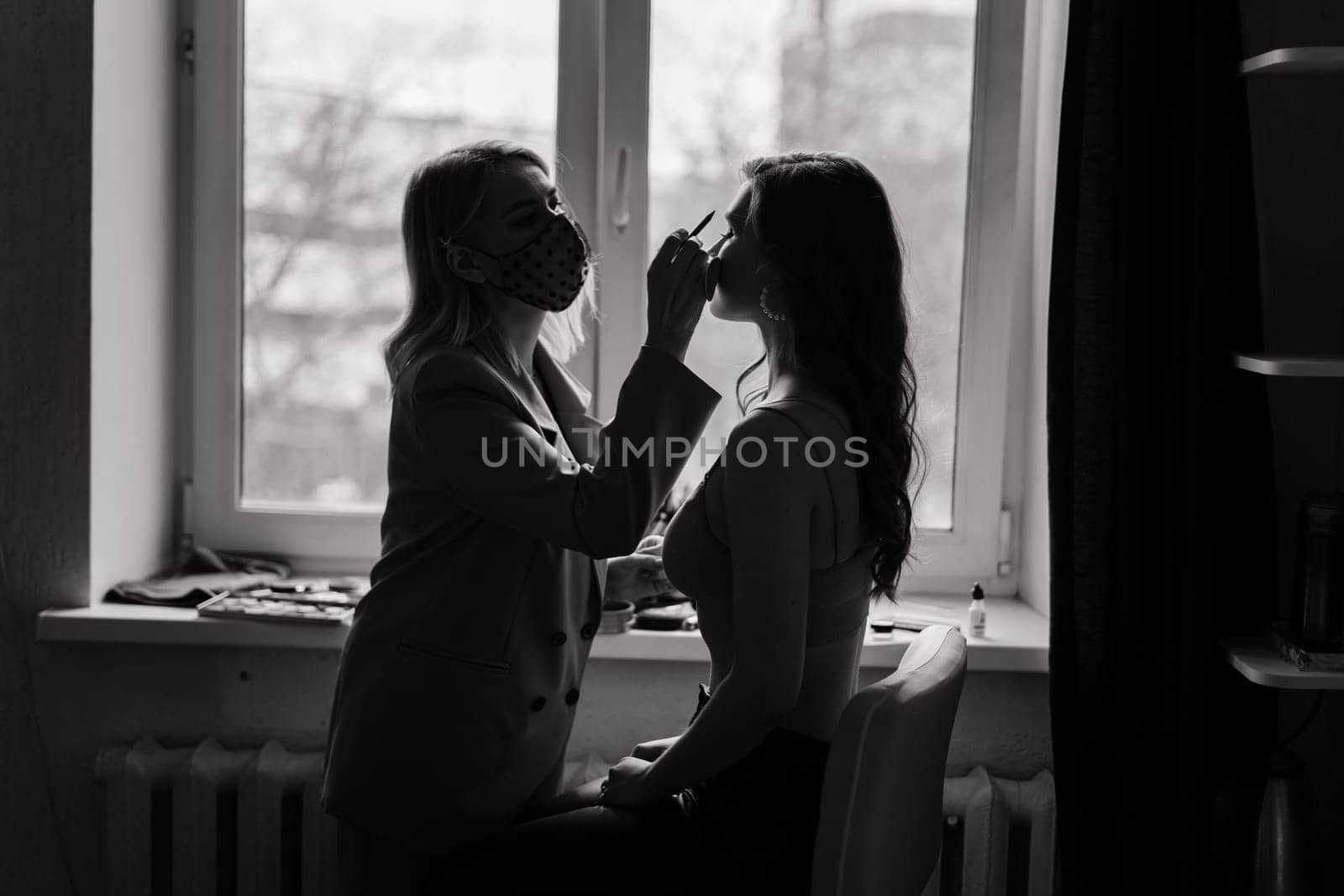 Make-up artist work in her studio with model by Zelenin