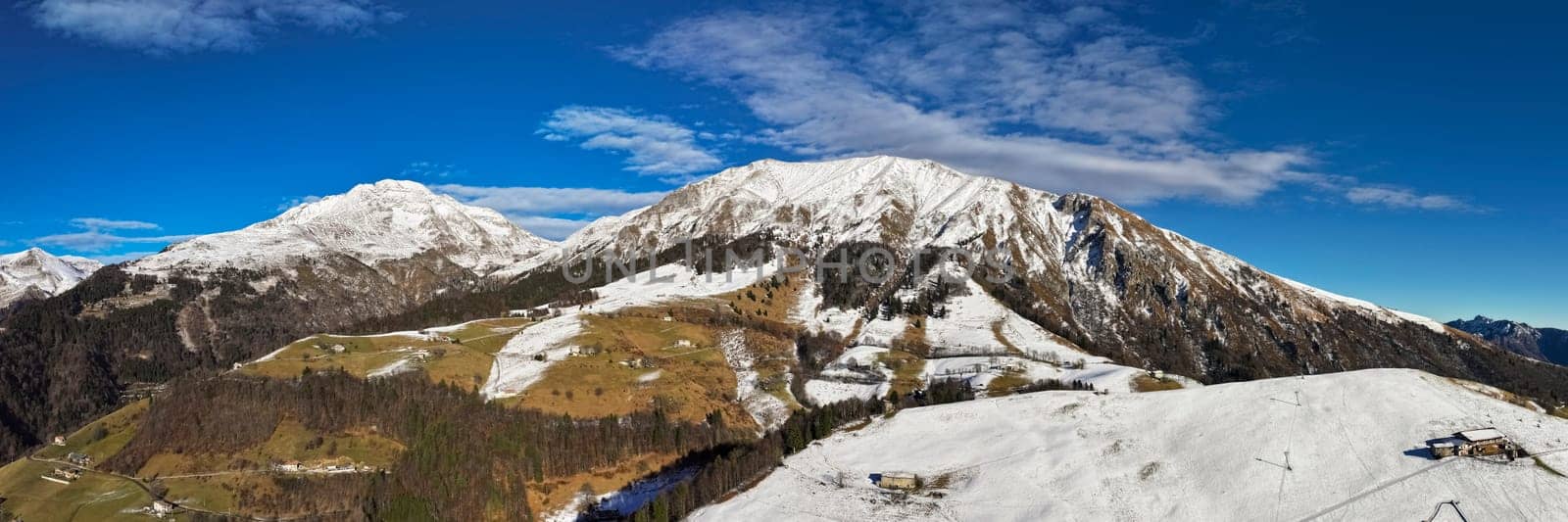 Aerial view of Orobie alps with snow at sunny day by Robertobinetti70