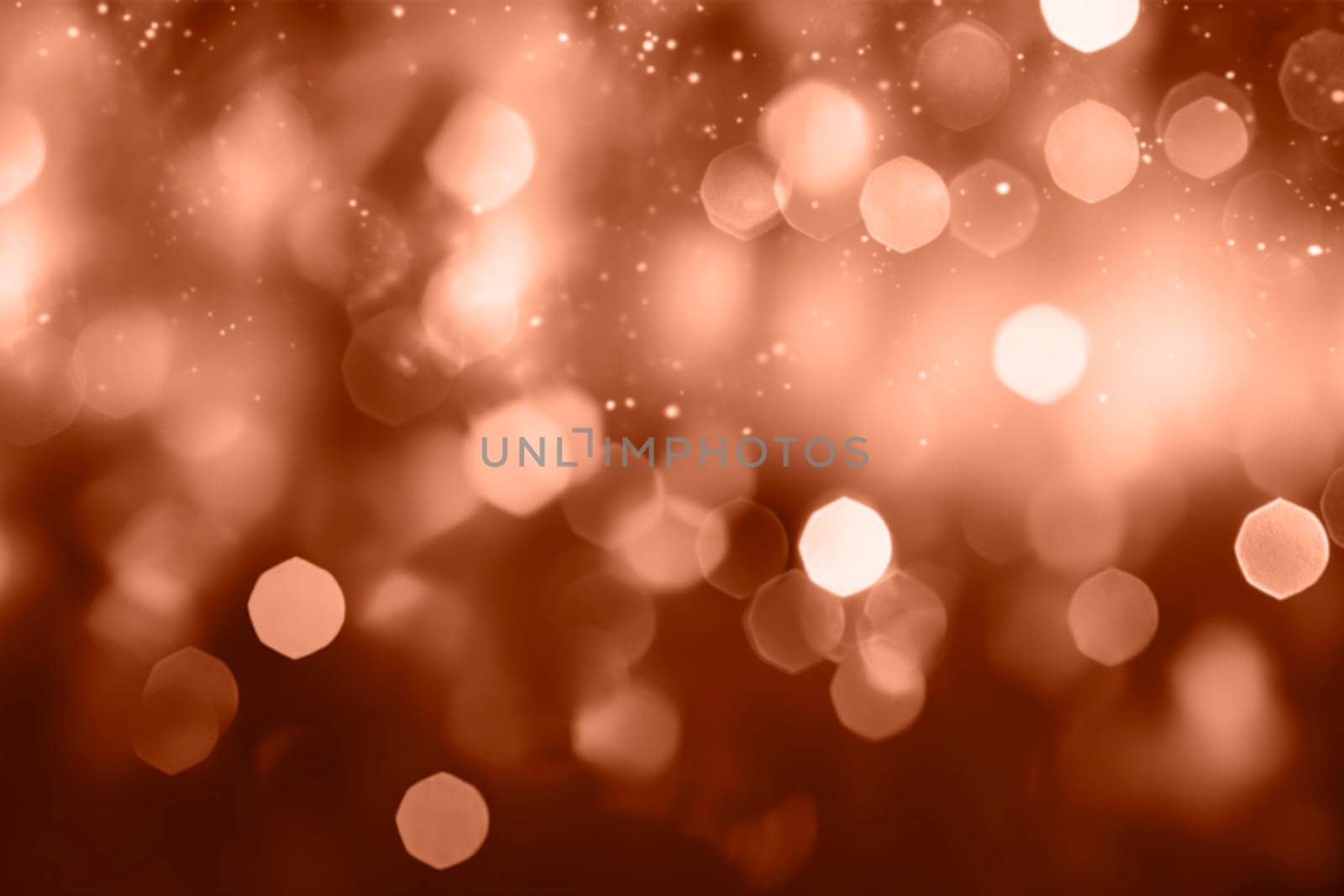 Peach fuzz lights bokeh background, Chrismas lights bokeh. Monochrome bokeh lens effect from lighting spots. Color 2024. High quality photo