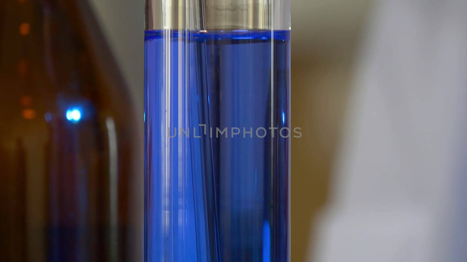 Scientist Pours Blue Pattern Chemicals Into In Flask. health care and medical concept. Scientist are certain activities on experimental science like mixing chemicals 4K