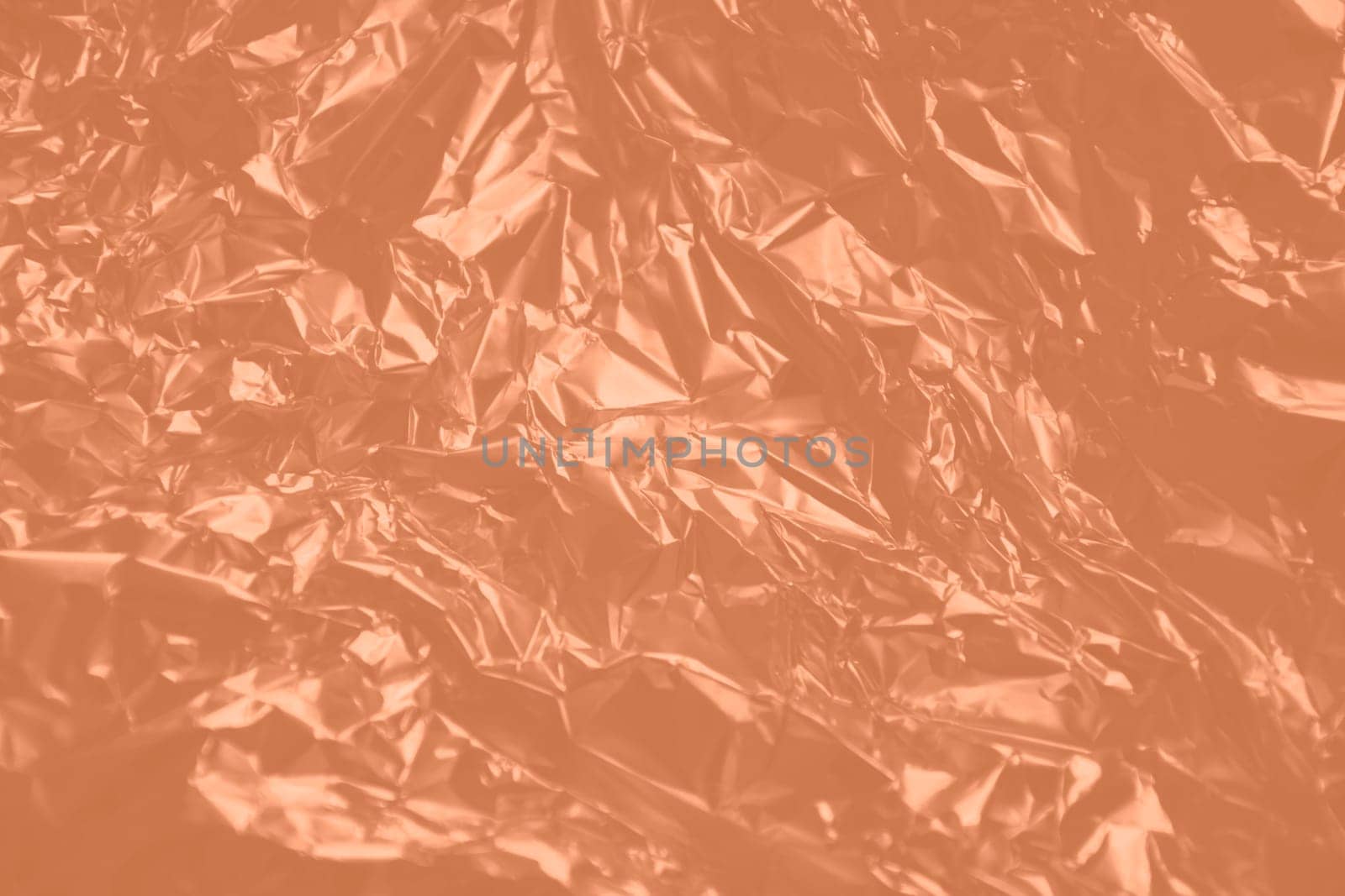 Texture foil Peach Fuzz color. Background for your design. Crumpled colored Peach Fuzz foil. by kizuneko