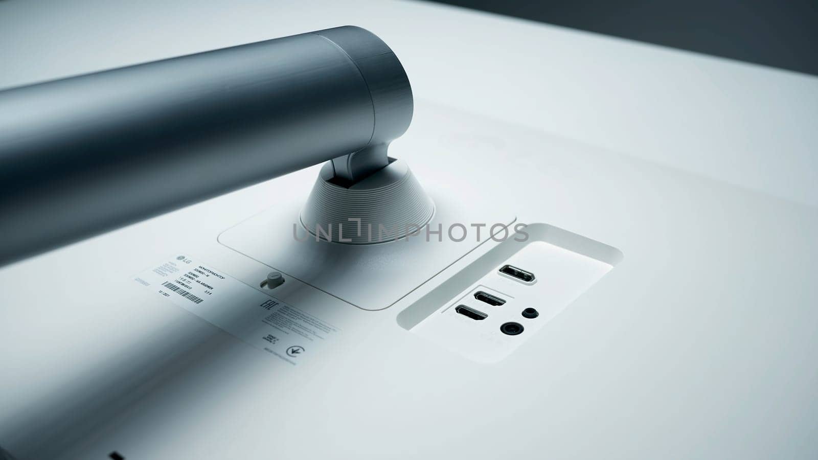 Italy, Rome - June 19, 2022: Close up of back of the monitor with usb ports. Action.. White back of monitor