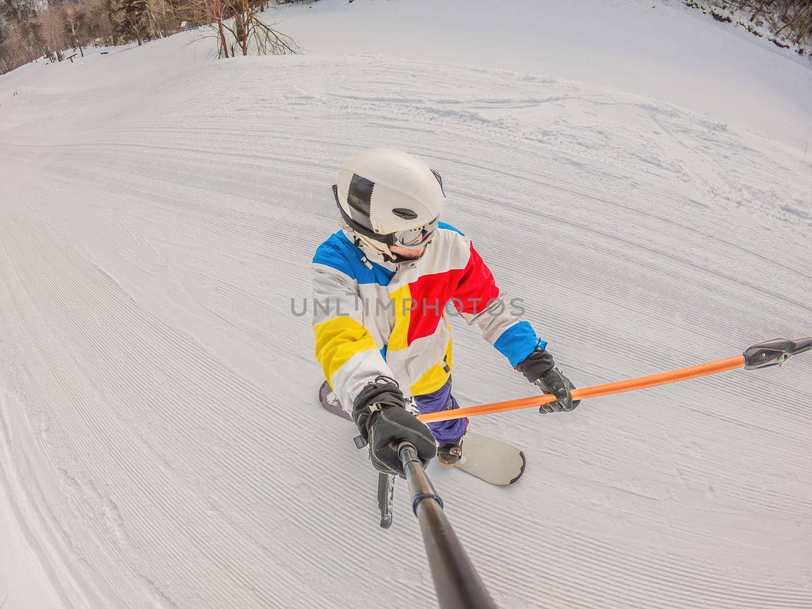 A daring man conquers snowy slopes with style, showcasing skill and thrill as he maneuvers on a snowboard, capturing the essence of winter adventure.