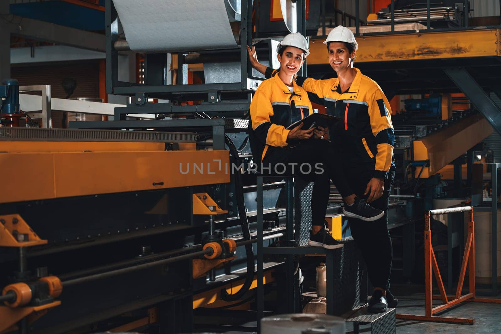 Professional quality control inspector conduct safety inspection on steel machinery and manufacturing process. Factory engineer or operator make optimization in heavy industry facility. Exemplifying