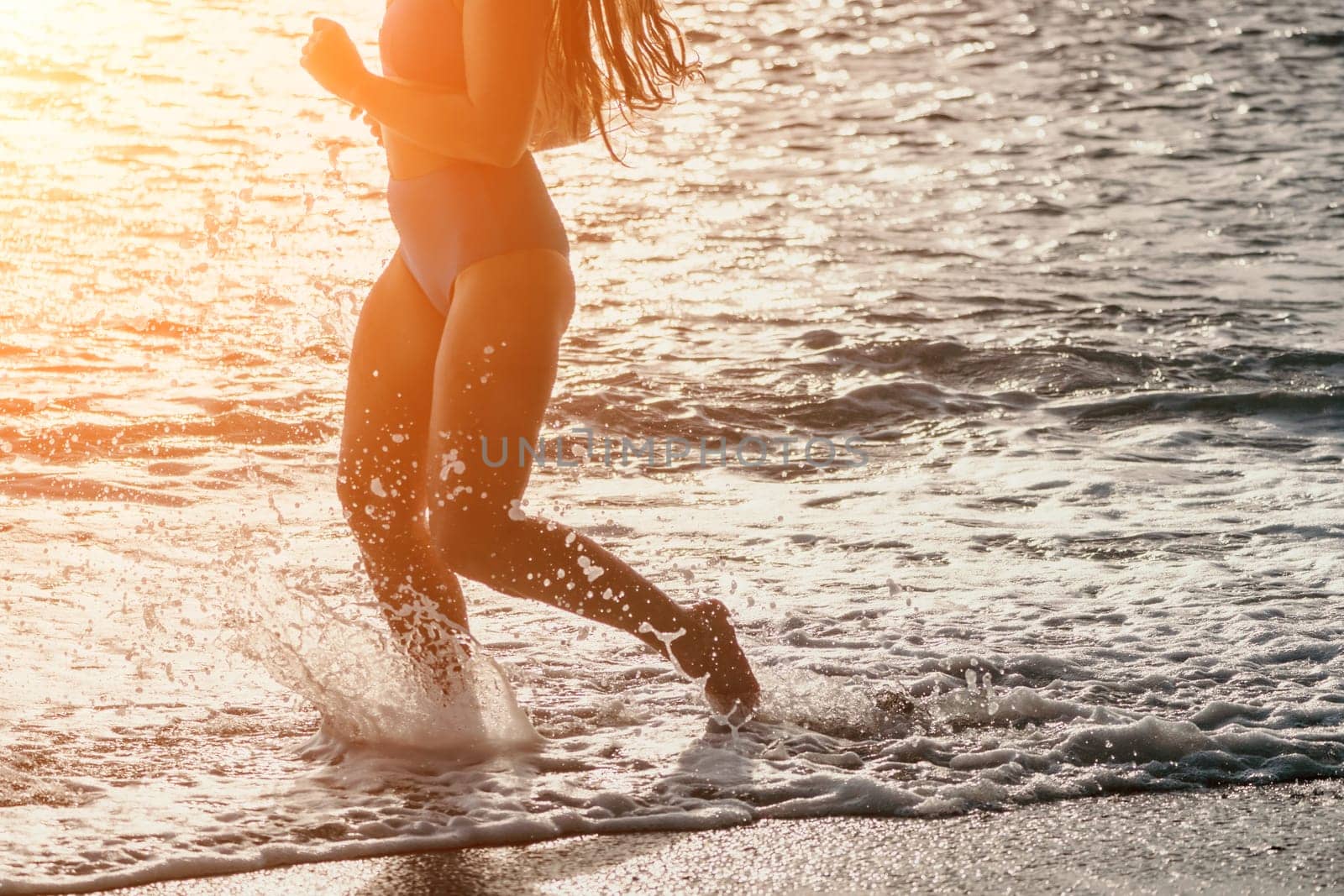 Running woman. Female runner jogging during the sunrise on beach. Woman Runner feet running on the beach at sunrise. woman fitness sunrise jog workout wellness concept.