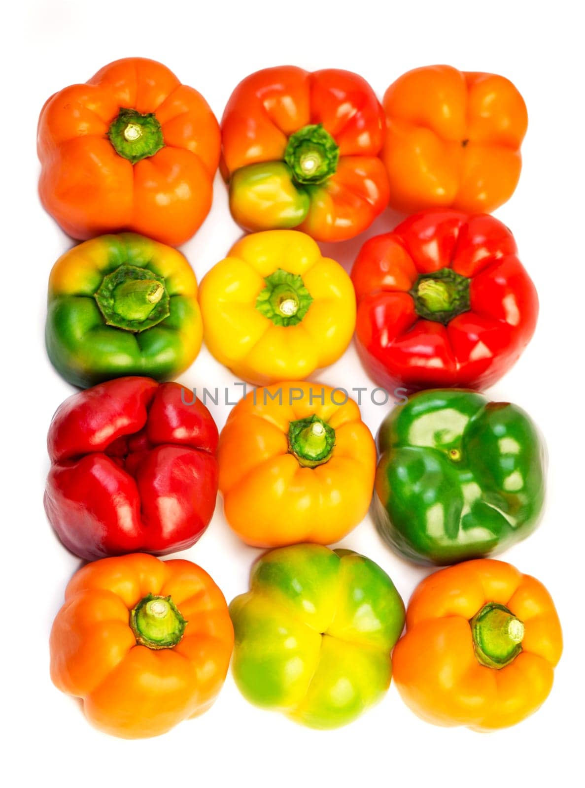 Set of colorful bell pepper isolated on white background top view. Raw red, yellow and green bell pepper. by aprilphoto