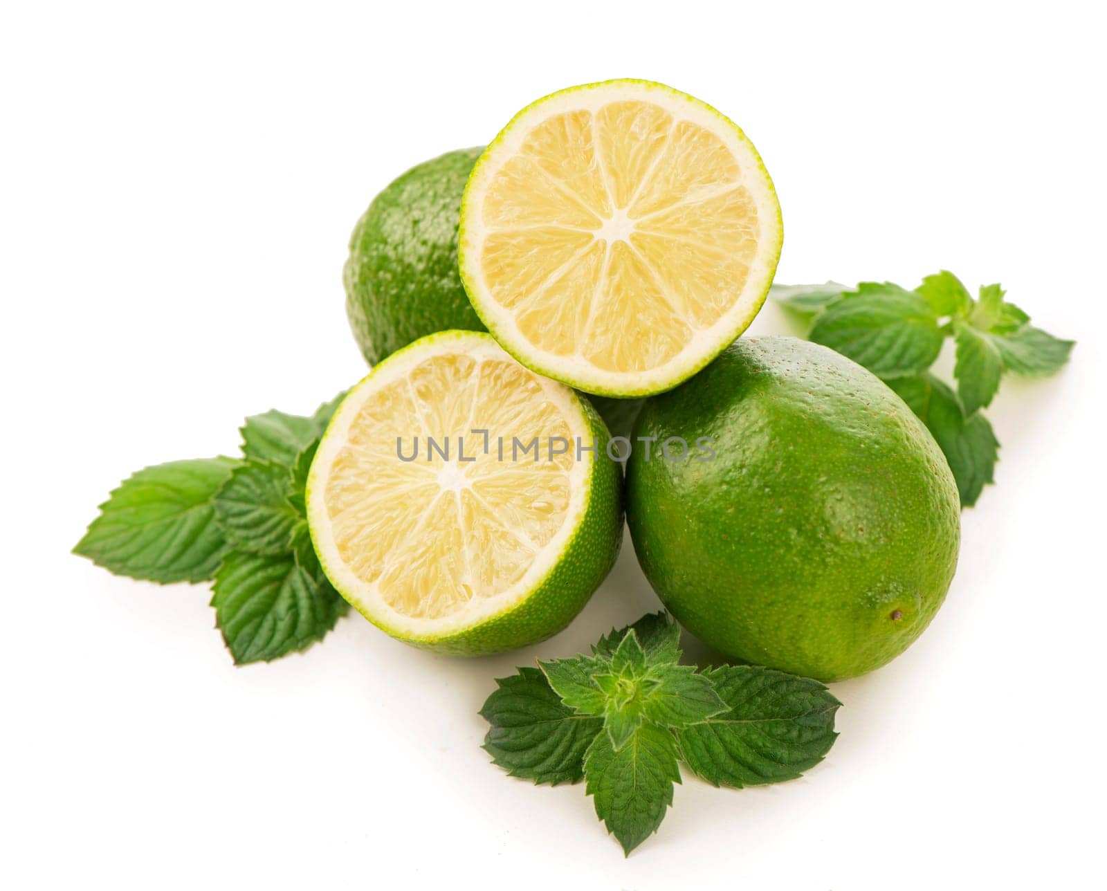 Fresh fruits and slices of limes, mint leaves isolated on white background by aprilphoto