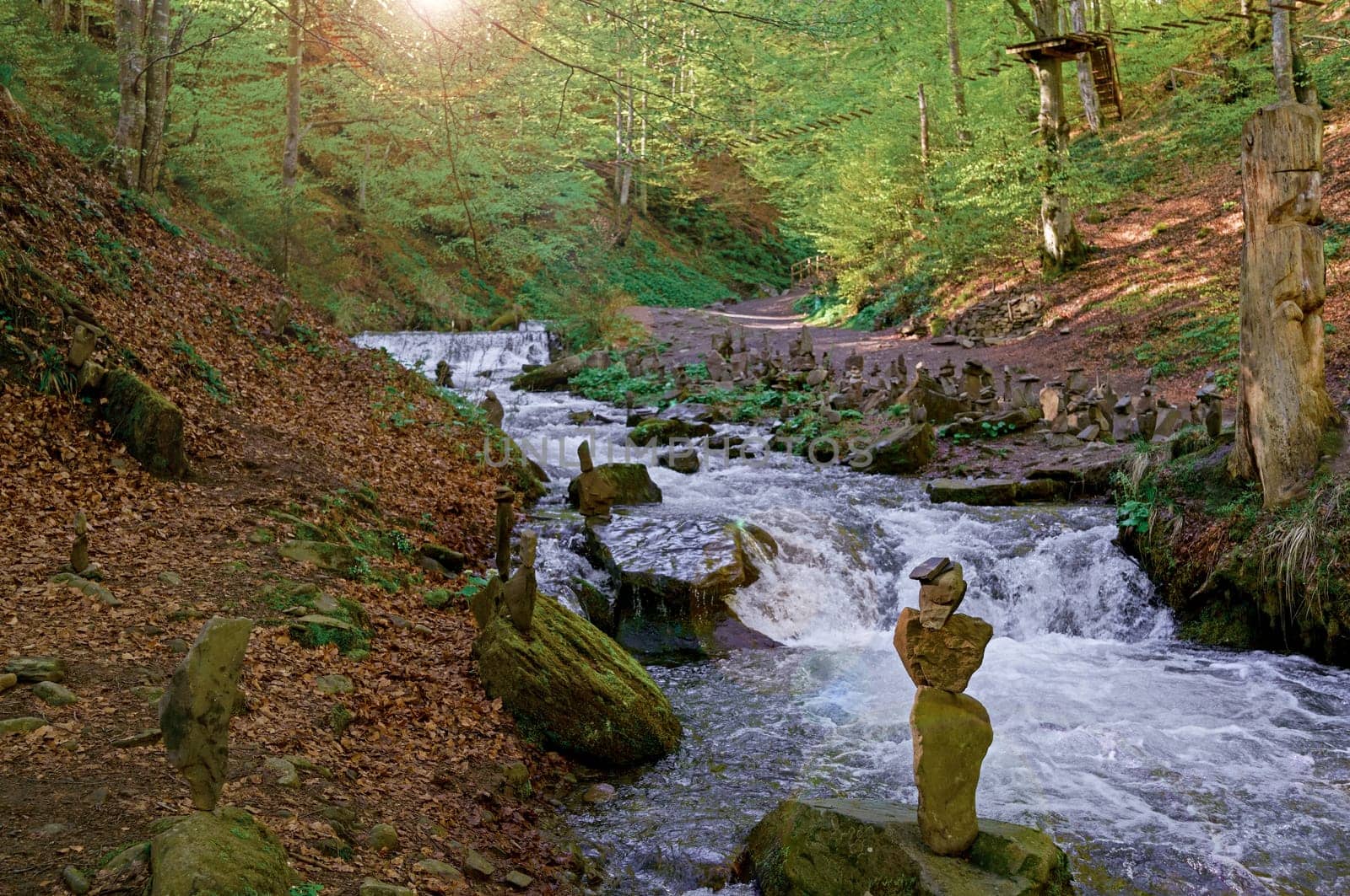 Ukraine. Carpathian Mountains. Forest and surroundings of the Shipit waterfall. Cairns by aprilphoto