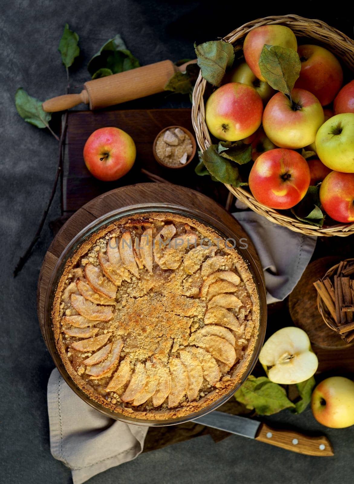 Homemade apple pie on dark rustic background, top view.