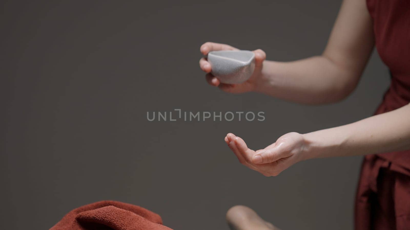 Spa treatments.Action.Applying oil to a woman's body, which is then rubbed and massaged. High quality 4k footage