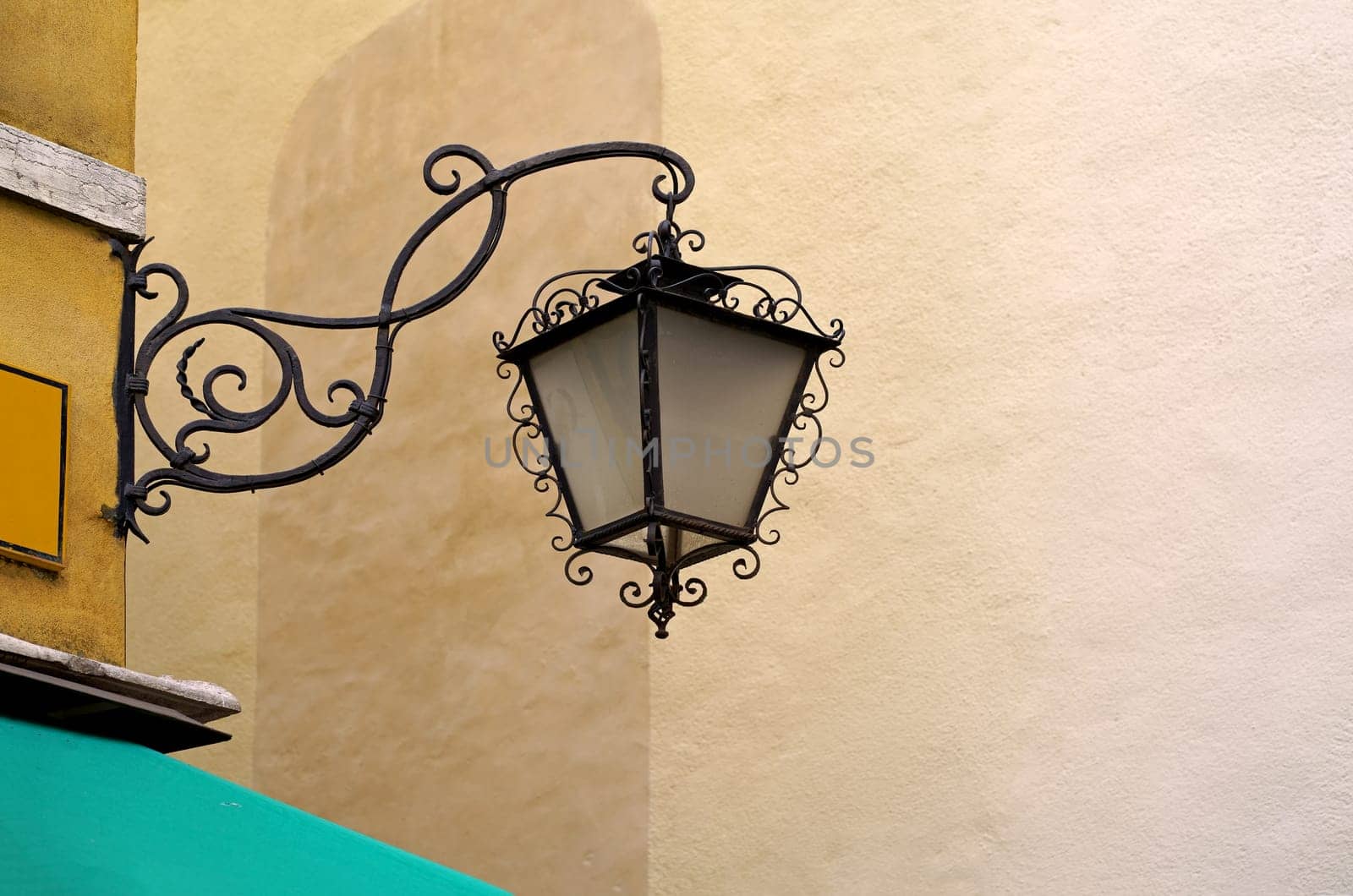 Lantern on the street of Venice. Vintage lantern used for public lighting on a typical Venice street. by aprilphoto