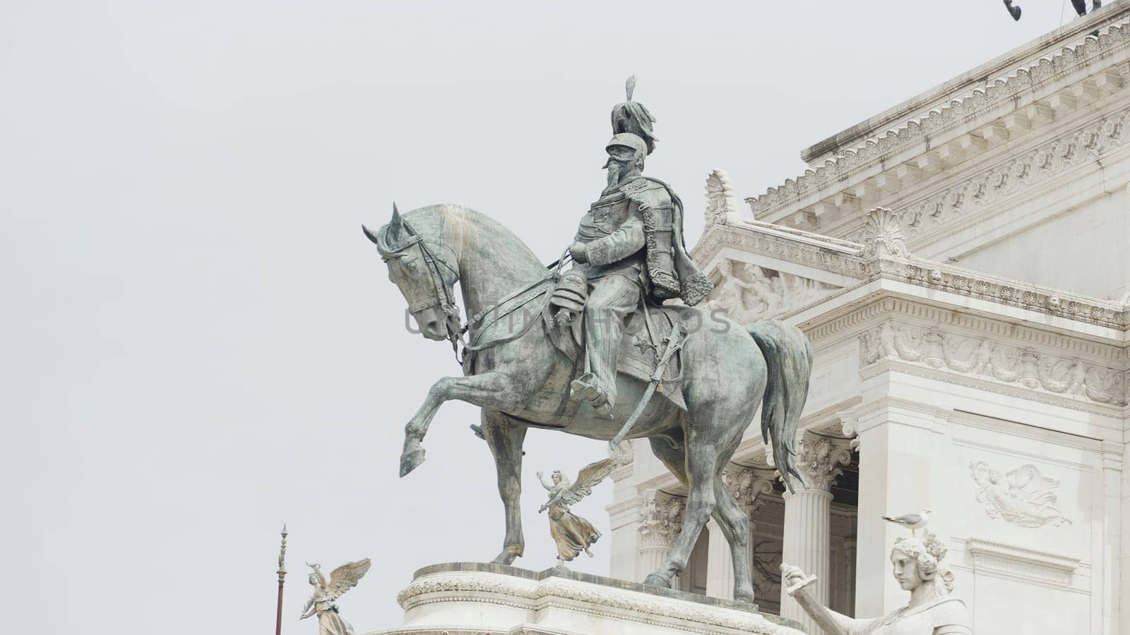 Italy, Milan - August 30, 2022: Famous statues of Italy. Action. Beautiful monuments in squares of Italy. Cultural attractions and sculptures on streets of ancient historical city. Monument to Victor Emmanuel II.