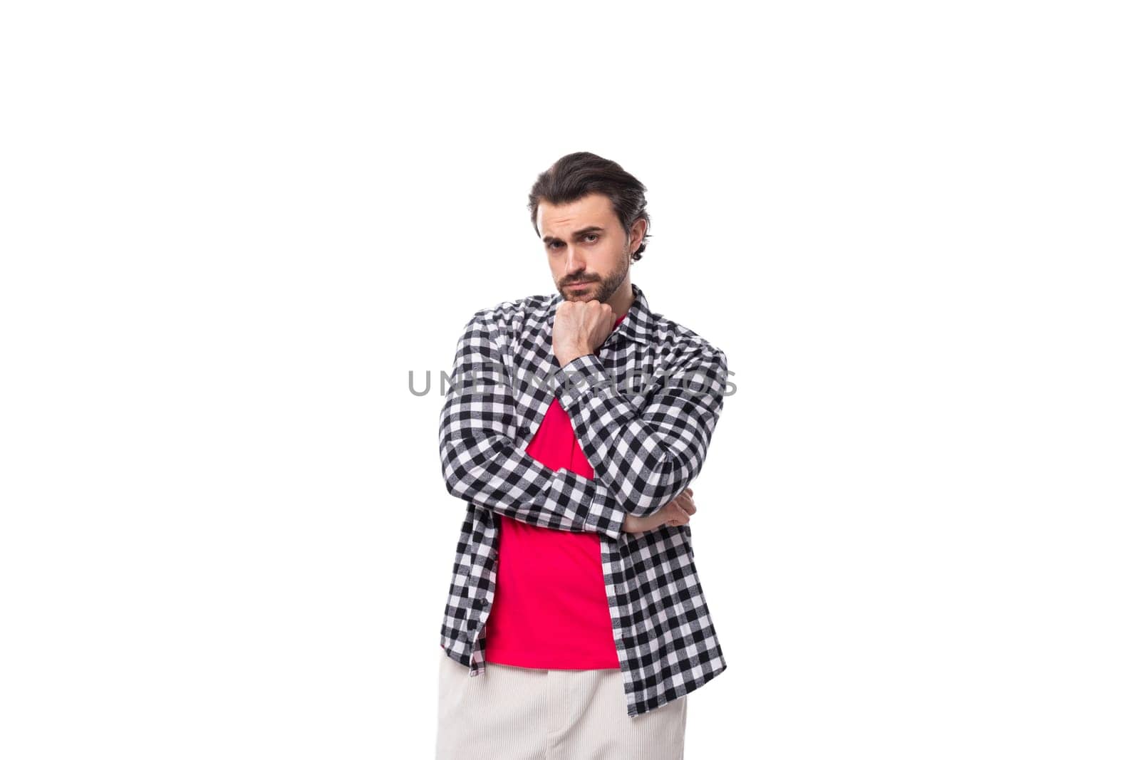 young smart caucasian handsome guy with a beard and styled hair on a white background with copy space.