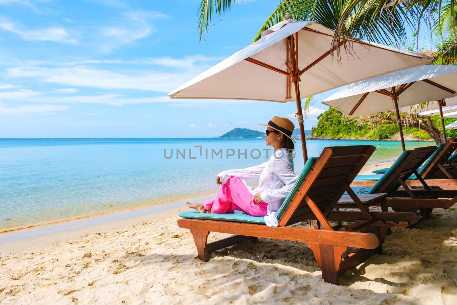 Asian woman on a beach chair on the beach of Koh Samet Island Rayong Thailand by fokkebok